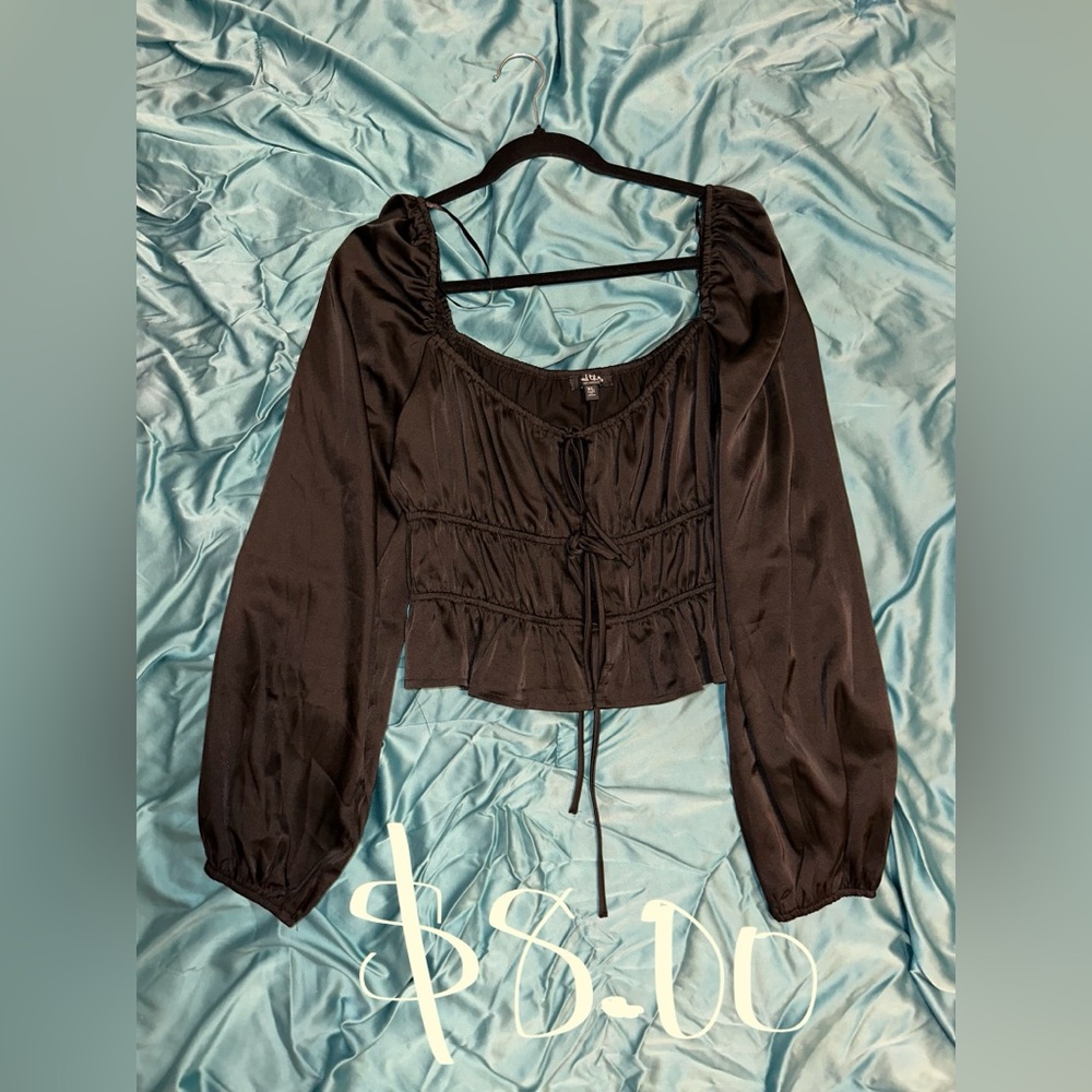Silk black blouse. Ties up in the front. Size XL in women’s.